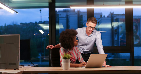 Image showing Multiethnic startup business team in night office