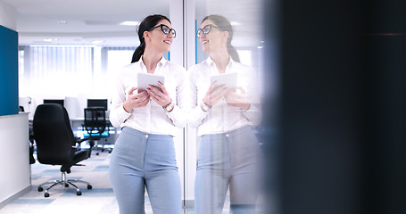 Image showing Business Woman Using Digital Tablet in front of Office