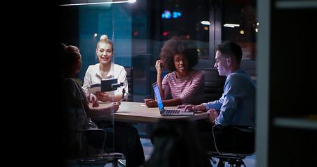 Image showing Multiethnic startup business team in night office