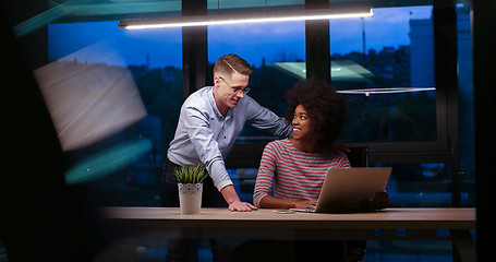 Image showing Multiethnic startup business team in night office