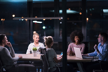 Image showing Multiethnic startup business team in night office