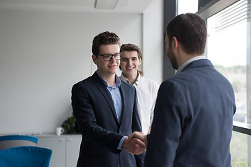 Image showing cloasing the deal in modern office interior