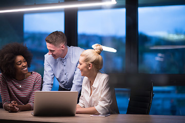 Image showing Multiethnic startup business team in night office