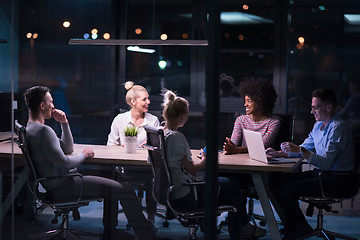 Image showing Multiethnic startup business team in night office