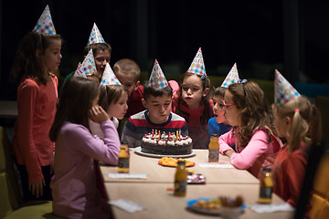 Image showing The young boy joyfully celebrating his birthday