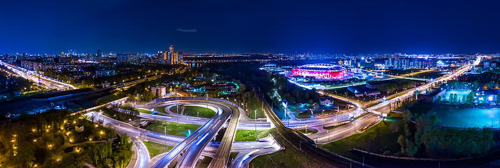 Image showing Night Aerial view panorama of a freeway intersection traffic tra