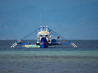 Image showing Outrigger fishing boat in the Philippines