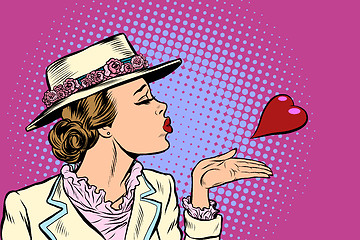 Image showing retro woman blowing a kiss