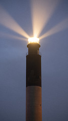 Image showing Oak Island Lighthouse Beams into the Seafoam at Fort Caswell