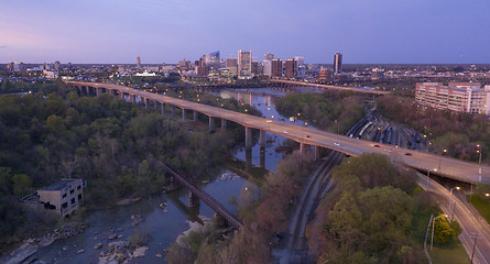 Image showing Evening Light Over Highways Heading Downtown City Skyline Riverf