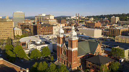 Image showing Historic buildings at the forefront in the downtown urban area o