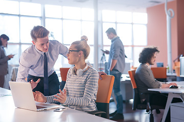 Image showing Two Business People Working With laptop in office