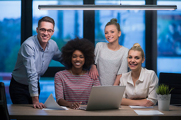 Image showing Multiethnic startup business team in night office