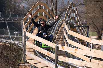 Image showing father and son enjoys driving on alpine coaster