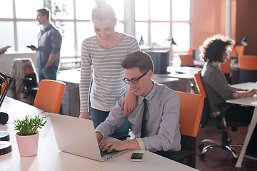 Image showing Two Business People Working With laptop in office