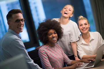 Image showing Multiethnic startup business team in night office