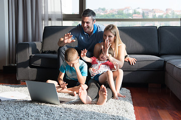 Image showing Family Playing Together with laptop computer