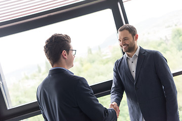 Image showing cloasing the deal in modern office interior