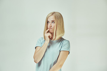 Image showing Young serious thoughtful business woman. Doubt concept.