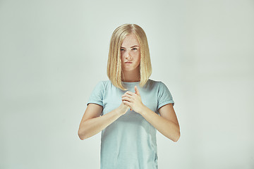 Image showing Young serious thoughtful business woman. Doubt concept.