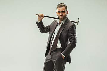 Image showing The barded man in a suit holding cane.