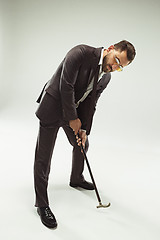 Image showing The barded man in a suit holding cane.