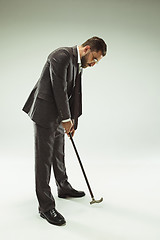 Image showing The barded man in a suit holding cane.