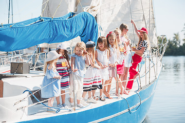 Image showing The children on board of sea yacht