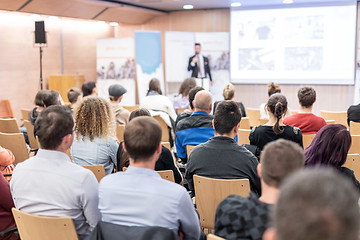 Image showing Business speaker giving a talk at business conference event.