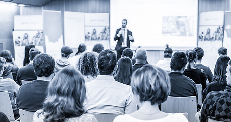 Image showing Business speaker giving a talk at business conference event.