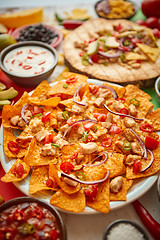 Image showing An overhead photo of an assortment of many different Mexican foods on a table