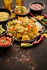 Image showing Fresh yellow corn nacho chips on ceramic plate