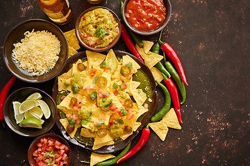 Image showing Tasty mexican nachos chips served on ceramic plate