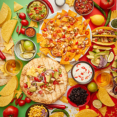 Image showing An overhead photo of an assortment of many different Mexican foods on a table