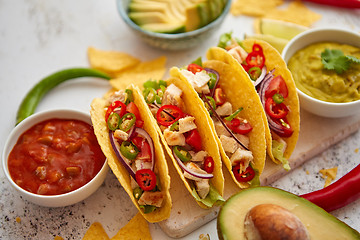 Image showing Tasty Mexican meat tacos served with various vegetables and salsa