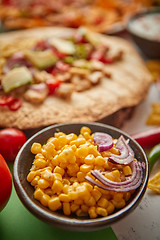 Image showing Close up on corn seeds with various freshly made Mexican foods assortment