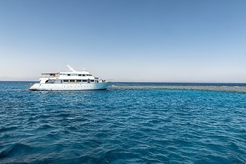 Image showing Luxury yacht docking near coral reef