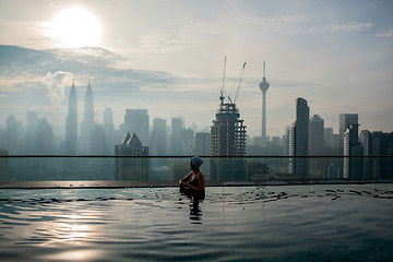 Image showing Relaxing in pool and enjoying city panorama. Kuala Lumpur, Malaysia