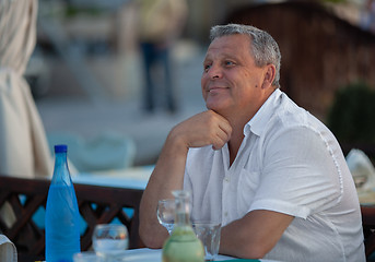 Image showing Charming mature man in outdoor cafe