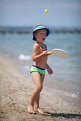 Image showing Playful boy on the beach. Fun on summer vacation