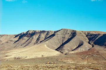 Image showing Volcanic hills and blue sky