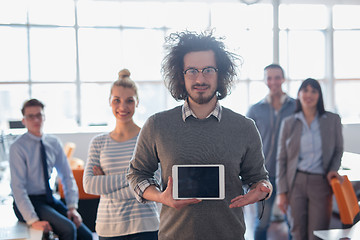 Image showing Portrait of a young businessman holding tablet