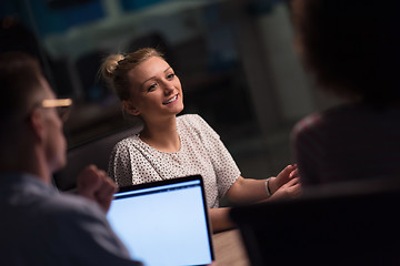 Image showing Multiethnic startup business team in night office