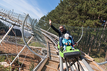 Image showing father and son enjoys driving on alpine coaster