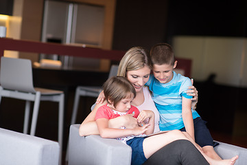 Image showing Young Family Using A Tablet To Make Future Plans