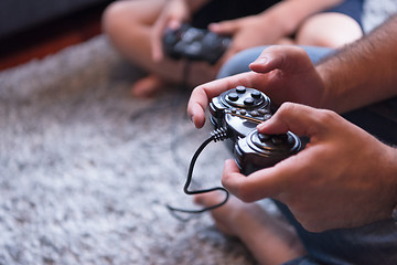 Image showing Happy family playing a video game