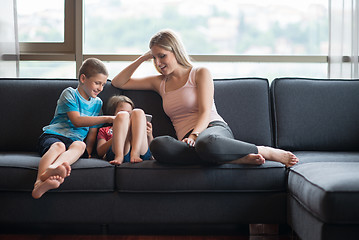 Image showing young mother spending time with kids