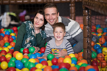 Image showing young parents with kids in a children\'s playroom