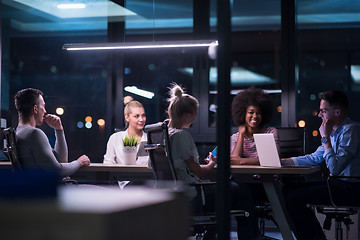 Image showing Multiethnic startup business team in night office