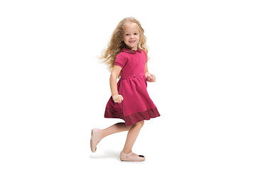 Image showing Smiling cute toddler girl three years running over white background